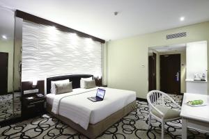 Krevet ili kreveti u jedinici u okviru objekta Hotel New Saphir Yogyakarta