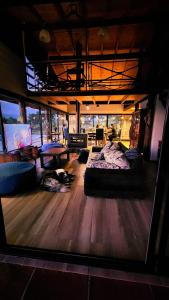 a large room with a bed in the middle of it at Colores de Yacanto in Villa Yacanto +100 photos