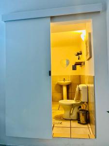 a bathroom with a toilet and a sink at Nandina Self Catering in Hazyview