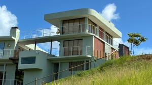a building on the side of a hill at Casa Luar da Sereia - Itacaré in Itacaré