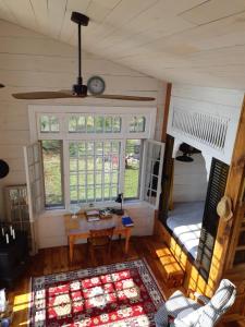 an overhead view of a living room with a table and a bed at Longview Spectacular Forest Views on 88 Acres in Westport
