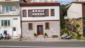 a building with a sign on the side of it at Kilitbahir Kale Konak in Eceabat