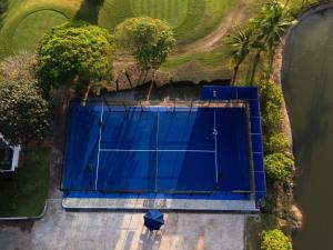 an overhead view of a tennis court with a tennis racket at Sofitel Krabi Phokeethra Golf and Spa Resort in Klong Muang Beach
