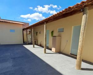 a row of buildings with garages at Suite Nomar 1 in Brotas