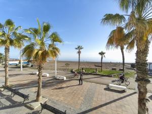 a group of people riding bikes on the beach at Beach house in Rincón de la Victoria