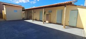 a row of garages in a parking lot at Suite Nomar 1 in Brotas +1 photo