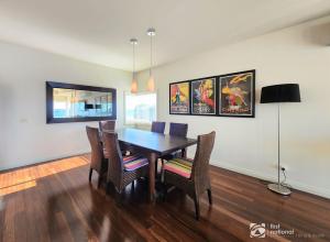 a dining room with a table and chairs at Bay Suite - Waterfront Apartment in Metung in Metung