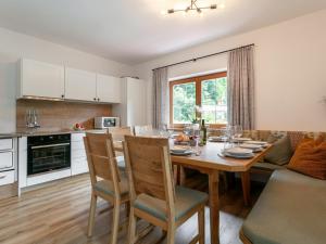 a kitchen and dining room with a table and chairs at Zellner Top 9 in Alpbach
