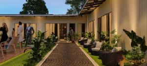a patio of a house with people standing outside at Orchid resort in Sultānpur