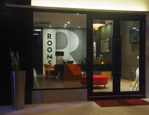 a store window with a red ottoman in a room at Rooms in Tawau