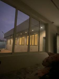 a room with a group of windows in a building at شاليه السيل الكبير in As Sayl al Kabīr