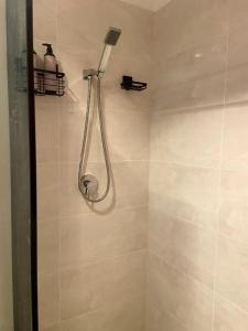 a shower with a shower head in a bathroom at Sunset Ridge - King Bed Cabin & Breakfast Basket in Boyland +12 photos
