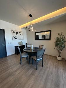 a dining room with a table and chairs at Exclusive Luxury Condo 2bd in Tijuana