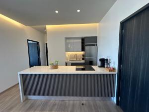 a kitchen with a large island in a room at Exclusive Luxury Condo 2bd in Tijuana