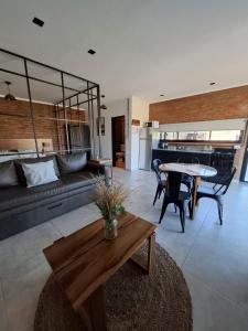 a living room with a couch and a table at Terrazas del Monte in San Miguel del Monte