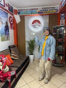 a woman is standing in a store at Lhotse Hostel B&B in Huaraz