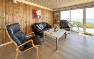 a living room with leather furniture and a table at Beautiful Home In Haderslev With Wifi in Haderslev