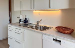 a kitchen with a sink and a counter top at Beautiful Home In Haderslev With Wifi in Haderslev