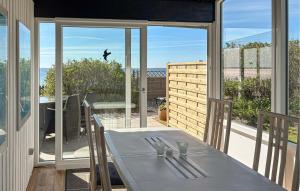 a white table with silverware on top of a balcony at Beautiful Home In Haderslev With Wifi in Haderslev