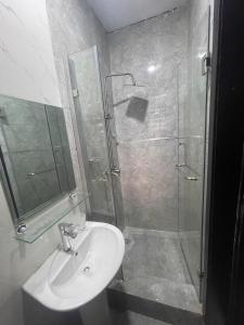 a bathroom with a sink and a shower at Luxury home in Lagos +22 photos