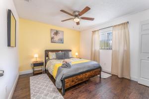 a bedroom with a bed and a ceiling fan at The Pelican/Pool/HotTub/GameRoom in Brandon +27 photos