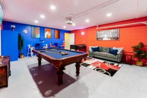 a living room with a pool table in it at The Pelican/Pool/HotTub/GameRoom in Brandon