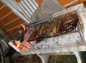 a grill with a bunch of food on it at Rincón Entrerriano in Concepción del Uruguay