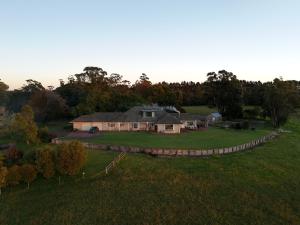 an aerial view of a large house in a field at Wingana Homestead - Scenic Views, Bundanoon in Bundanoon