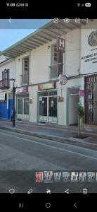 a building on the side of a city street at Casa Hotel la Alsacia in Santa Rosa de Cabal