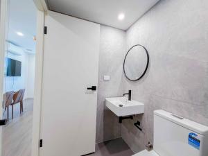 a bathroom with a sink and a mirror on the wall at Auburn Studio, Entire Studio with Ensuite toilet and kitchen in Sydney +17 photos