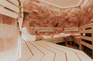 A bed or beds in a room at Wellnesshotel Aumühle