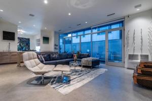 a living room with a couch and a table at Luxury 2BR 2BA w Pool and Large Pets Allowed in Dallas
