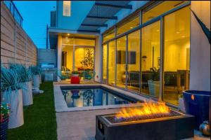 a backyard with a pool and a fire pit at Luxury 2BR 2BA w Pool and Large Pets Allowed in Dallas