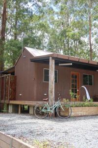a bike parked in front of a house at Amoré Cabin in Ocean View