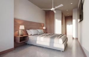 a bedroom with a large bed with a wooden headboard at Nuruma Suites by Avia Suites in Santa Marta +25 photos