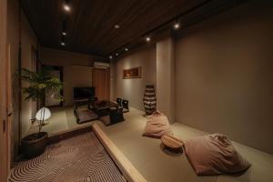 a living room with a couch and a table at New Open KIKUNOYA-sora- in Nagoya