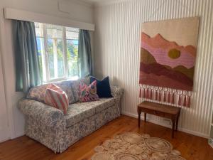 a living room with a couch and a table at Birchmoore Studio in Penola