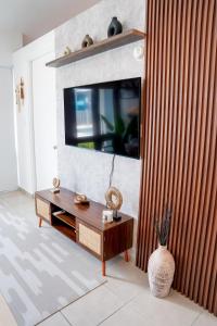 a living room with a flat screen tv on a wall at Villa Lua, Boqueron, Puerto Rico in Cabo Rojo