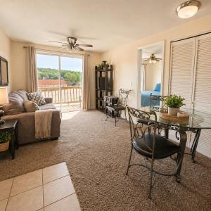 a living room with a couch and a table at Buccaneer Bay Bungalow #8 in Sunrise Beach