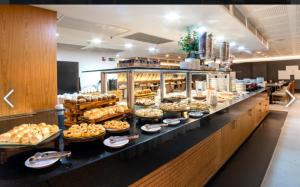 a buffet line with many different types of food at Sant copacabana in Rio de Janeiro
