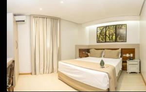 a bedroom with a large bed and a window at Sant copacabana in Rio de Janeiro +22 photos