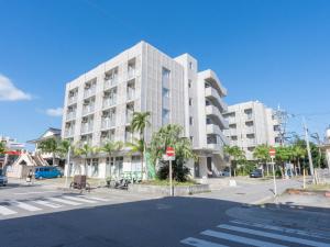 an empty street in front of a large building at The BREAKFAST HOTEL PORTO Ishigakijima in Ishigaki Island