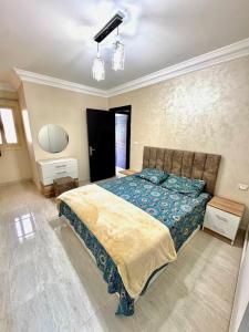 a bedroom with a large bed in a room at Lasirena Palm Beach Sokhna Chalet in Ain Sokhna +25 photos