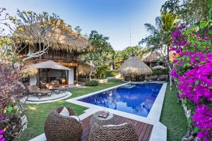 an image of a villa with a swimming pool at Jabeki Bungalows Bingin Beach, Uluwatu in Uluwatu