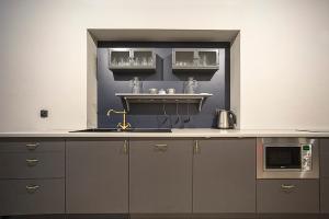 a kitchen with a sink and a counter top at MoHo L in Wrocław