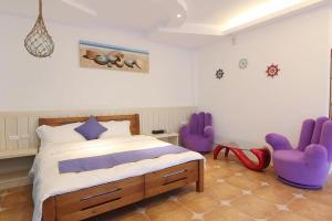Letto o letti in una camera di Zi Jìng Fang Inn