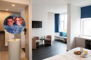 TV a/nebo společenská místnost v ubytování Hotel Portinari