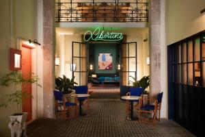 a lobby with tables and chairs in a building at Hotel Casa Bonay & Spa in Barcelona