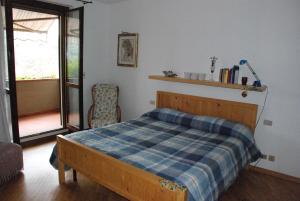 Postel nebo postele na pokoji v ubytování Gli Oleandri di Belfiore