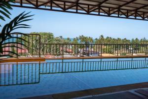 a swimming pool with a view of a resort at 6 Bedrooms Seaview With Pool - Belle Sunset Villa in Ko Lanta
